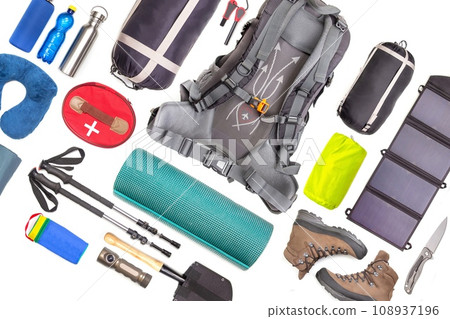 Set of tourist trekking items on white background. Top view of accessories for travel. 108937196