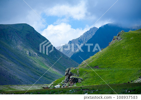 Landscape high mountains in dense fog tops of mountains in clouds North Caucasus Elbrus Landscape high mountains in dense fog tops of mountains in clouds North Caucasus Elbrus 108937583
