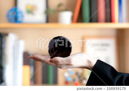 Craft image of bookshelf and hand-held earth Craft image of bookshelf and hand-held earth 108939170