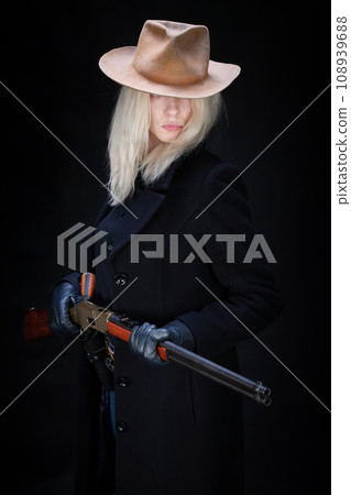Old west girl in white hat with rifle 108939688