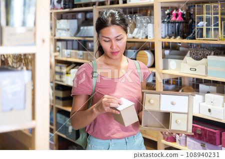 Woman choosing sundries storage box 108940231