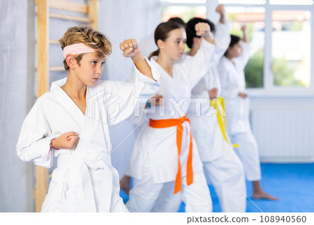 Preteen children during karate training. Martial arts. Sport, active lifestyle concept 108940560