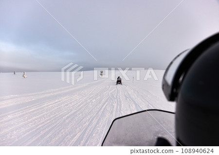 Snow mobile trip in Lapland as a passenger Snow mobile trip in Lapland as a passenger 108940624
