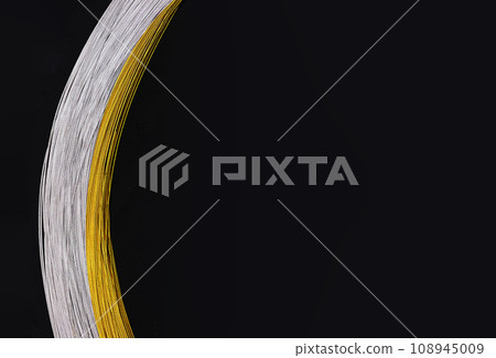 Gold and silver festive braid on black cross background Gold and silver festive braid on black cross background 108945009