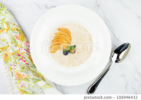 healthy breakfast with fruits in a white plate side view 108946432