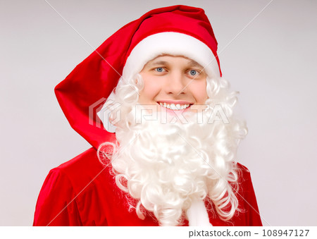 Christmas image photo, AI-generated image of a smiling white man cosplaying as Santa Claus 108947127