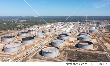 Portugal Sines oil terminal storage tanks, aerial view, oil and gas storage tanks, oil refinery chemical products. Portugal Sines oil terminal storage tanks, aerial view, oil and gas storage tanks, oil refinery chemical products. 108948064
