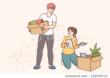 Happy couple moves into new apartment, unpacking boxes and rejoicing at improved home conditions 108948524