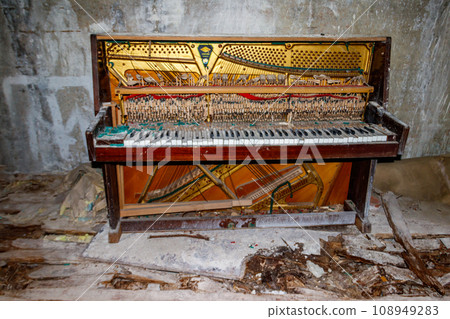 Old piano in abandoned apartment in the ghost town Pripyat in Chernobyl Exclusion Zone, Ukraine 108949283