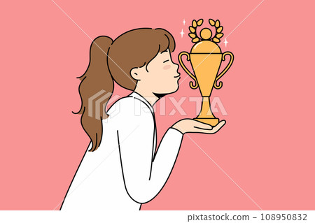 Little girl leader kisses golden cup won in school olympiad or sports competition Little girl leader kisses golden cup won in school olympiad or sports competition 108950832