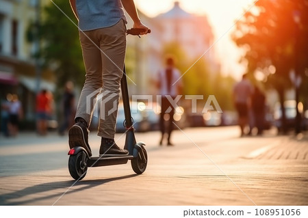 Person using scooter in the city traveling on eco friendly and sustainable transport. Generative AI 108951056