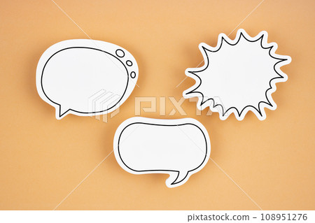 White chat bubbles on yellow background. Horizontal composition. White chat bubbles on yellow background. Horizontal composition. 108951276