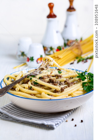 Macaroni with minced meat and herbs. 108951648