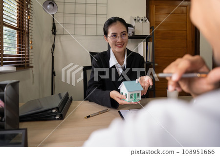 Client meet and negotiate with real estate agent about rent, buy home, talk about the terms of the home purchase agreement and asked customer to signs contract Client meet and negotiate with real estate agent about rent, buy home, talk about the terms of the home purchase agreement and asked customer to signs contract 108951666