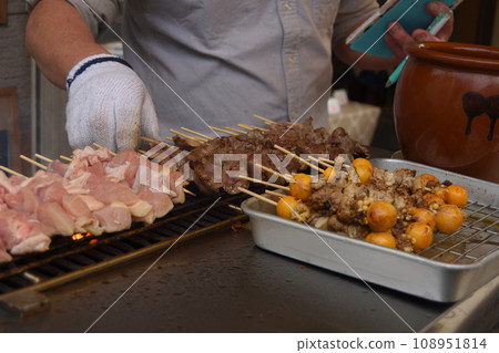 Grilling yakitori at a food stall Grilling yakitori at a food stall 108951814