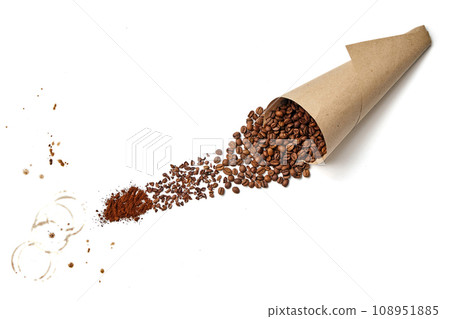 Roasted coffee beans in a bag made of craft paper, poured onto a white background and ground into powder. Top view isolated on white background Roasted coffee beans in a bag made of craft paper, poured onto a white background and ground into powder. Top view isolated on white background 108951885
