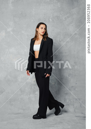 Young woman walking, she looked around as if she had been called out 108952368