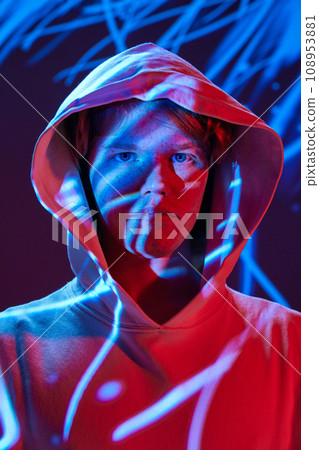 Futuristic modern portrait of young, calm man posing in vivid neon, abstract digital multicolored light and projector reflection. Futuristic modern portrait of young, calm man posing in vivid neon, abstract digital multicolored light and projector reflection. 108953881