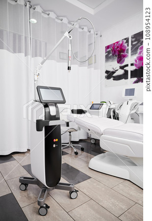 Cosmetologist cabinet with radiofrequency microneedling device for collagen induction therapy. Professional cosmetology equipment for skincare rejuvenation treatment in beautician office. 108954123