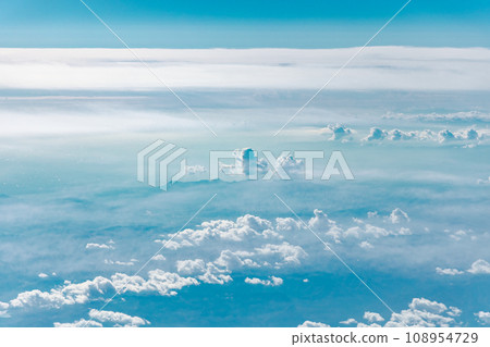 Calm sky scenery floating in a sea of clouds Calm sky scenery floating in a sea of clouds 108954729