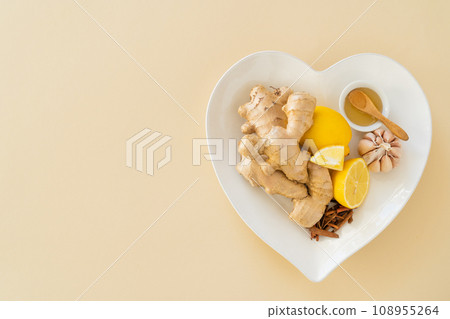 Natural immune system boosters - lemon, ginger, garlic, honey and drugs, thermometer, stethoscope Natural immune system boosters - lemon, ginger, garlic, honey and drugs, thermometer, stethoscope 108955264