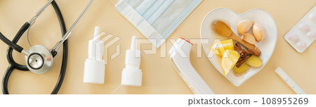 Natural immune system boosters - lemon, ginger, garlic, honey and drugs, thermometer, stethoscope 108955269