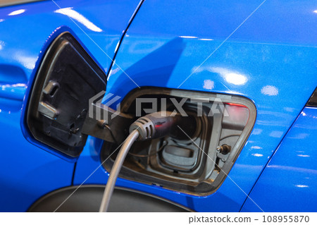 An Electric Blue Car Charging Up for the Future An Electric Blue Car Charging Up for the Future 108955870