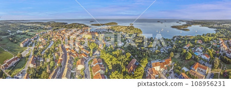 Panoramic drone picture of the Croatian harbor town of Vrsar on the Limski Fjord from the church bell tower Panoramic drone picture of the Croatian harbor town of Vrsar on the Limski Fjord from the church bell tower 108956231
