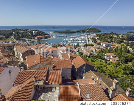 Panoramic picture of the Croatian harbor town of Vrsar on the Limski Fjord from the church bell tower 108956274