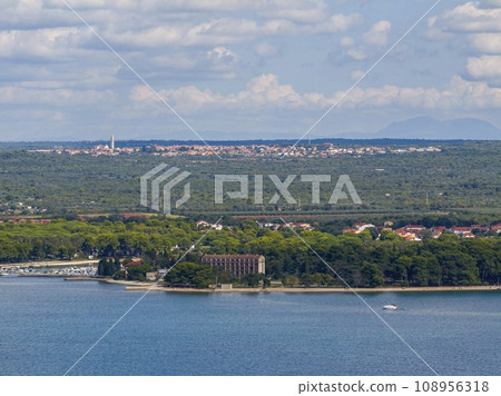 Drone image of the historic Croatian town of Voznjan from a great distance from the coast Drone image of the historic Croatian town of Voznjan from a great distance from the coast 108956318