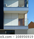 Modern residential building with balconies 108956919