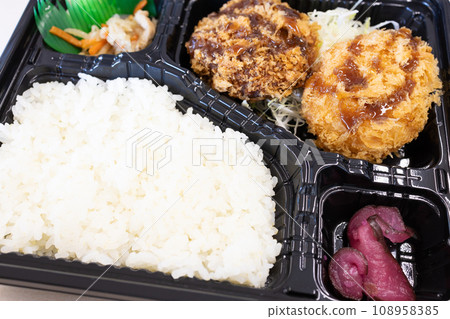 Delicious cream croquette and minced meat cutlet bento Delicious cream croquette and minced meat cutlet bento 108958385