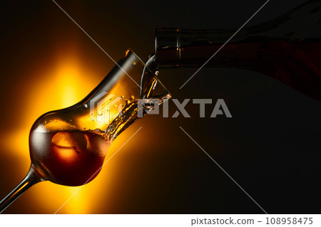 Steamed glass with strong alcoholic drink. 108958475