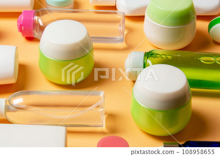 Group of plastic bodycare bottle Flat lay composition with cosmetic products on colored background empty space for you design. Set of White Cosmetic containers, top view with copy space Group of plastic bodycare bottle Flat lay composition with cosmetic products on colored background empty space for you design. Set of White Cosmetic containers, top view with copy space 108958655