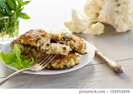 cooked vegetarian fried cauliflower cutlets, in a plate . cooked vegetarian fried cauliflower cutlets, in a plate . 108958846