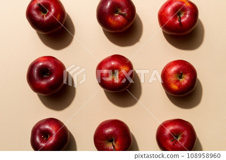 Many red apples on colored background, top view. Autumn pattern with fresh apple above view 108958960