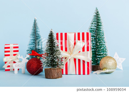 Christmas composition. craft Gift box, small tree, branches and craft DIY decorations on white background. New year concept. Christmas home decoration Flat lay, top view, copy space 108959034