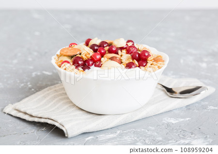 Healthy breakfast food with granola, yogurt, fruits and nuts. Dessert parfait with dried fruits for breakfast 108959204