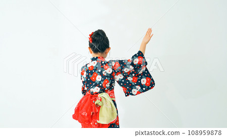 A girl wearing a yukata and dancing Bon Odori A girl wearing a yukata and dancing Bon Odori 108959878