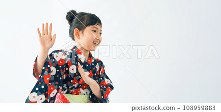 A girl wearing a yukata and dancing Bon Odori 108959883