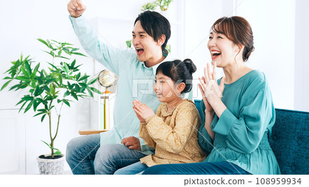 Parents and children excited to watch TV Parents and children excited to watch TV 108959934