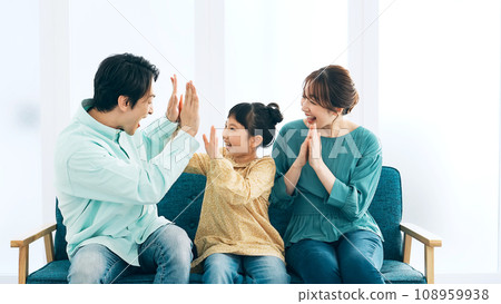 Parents and children excited to watch TV Parents and children excited to watch TV 108959938
