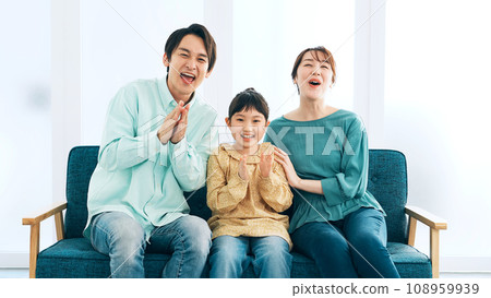 Parents and children excited to watch TV 108959939