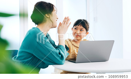 Girl using a computer in her room Programming class Girl using a computer in her room Programming class 108959953