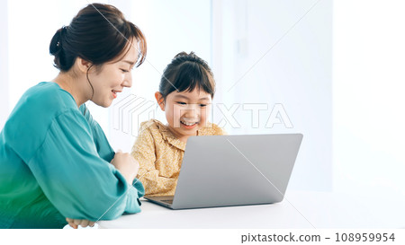Girl using a computer in her room Programming class Girl using a computer in her room Programming class 108959954
