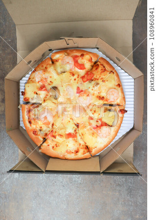 a box of pizza ,shrimp pizza 108960841