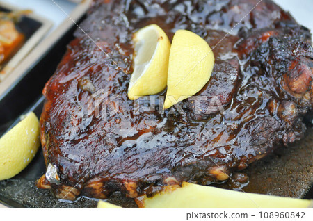 barbecue pork rib or grilled pork rib with potato and lemon 108960842