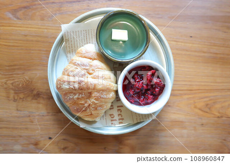 croissant ,French croissant or chocolate croissant or French bread with butter and blueberry dressing 108960847