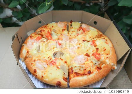 a box of pizza ,shrimp pizza a box of pizza ,shrimp pizza 108960849