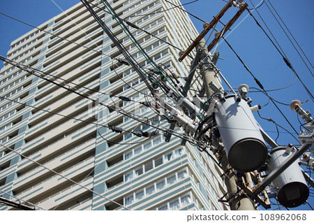 Landscape of high-rise apartment buildings and city utility poles and wires Landscape of high-rise apartment buildings and city utility poles and wires 108962068